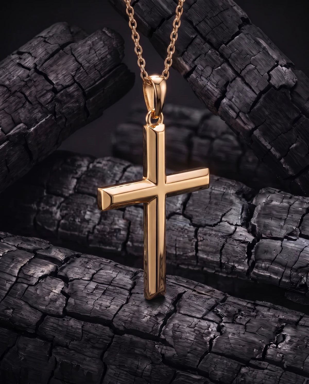 Facet Cross gold pendant turned to show its solid square-section depth and bail