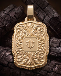 Championship Trophy Buckle back plate with engraved floral scrollwork and monogram